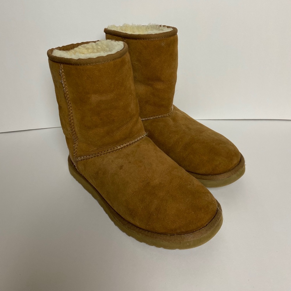 Woman’s brown Ugg’s boots